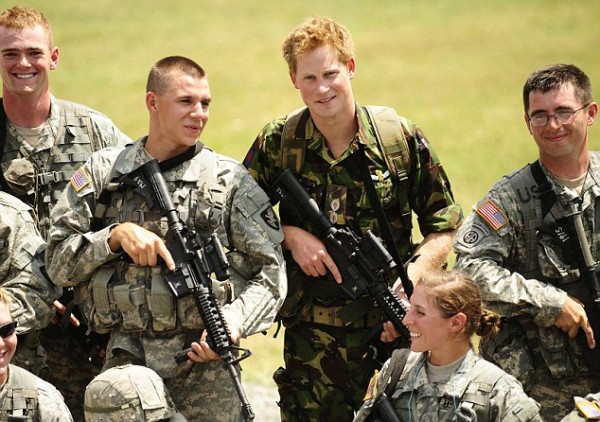 Britian's Prince Harry poses with US military cadets during a visit to the US Military Academy at West Point in New York