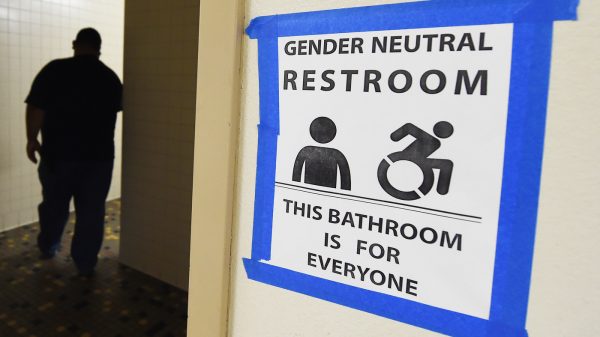 Signs are posted outside Santee High School's gender neutral restrooms at its campus in Los Angeles on May 4