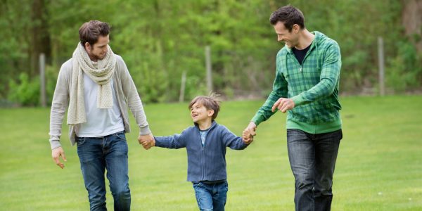 CWCNPM Boy walking with two men in a park. Image shot 2012. Exact date unknown.